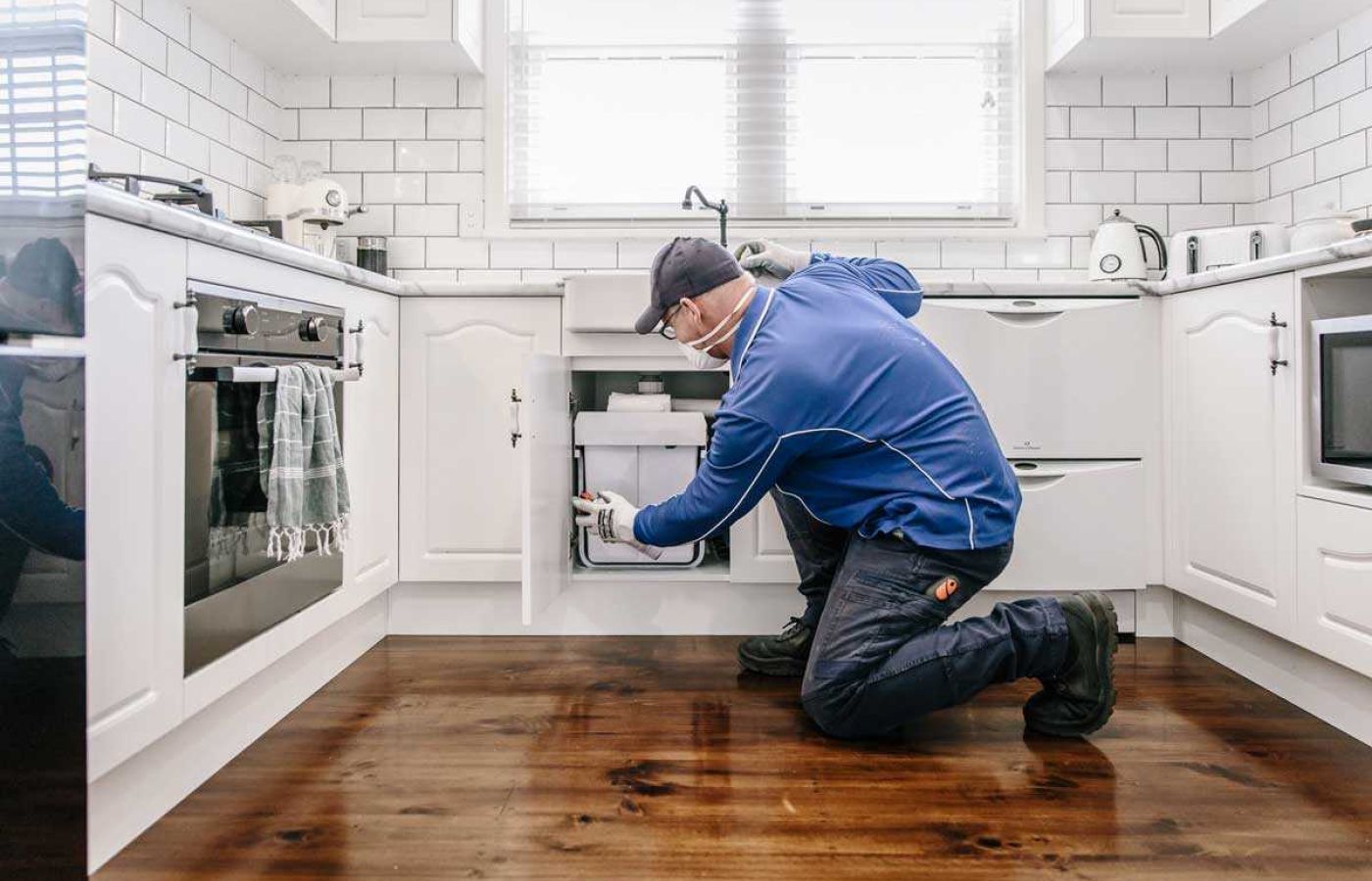 Applying general pest control treatment indoors